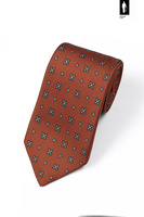Pomarańczowy krawat jedwabny z zielono-niebieskim mikrowzorem